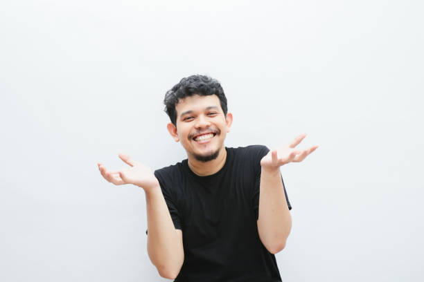 istock an asian man shows a curious expression with open arms 2153475745