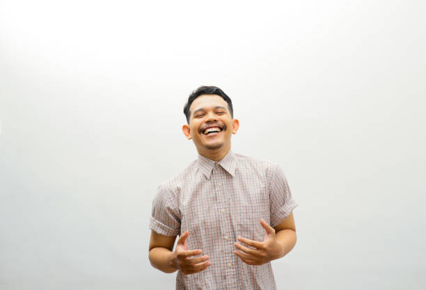istock Asian young man laughing with arms open 2153475914