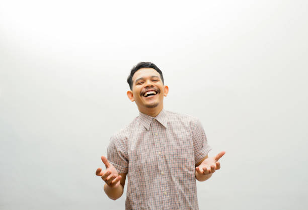 istock Asian young man laughing with arms open 2153475915