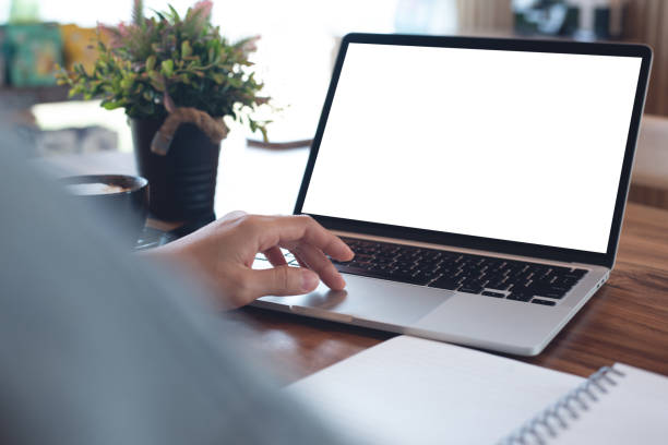 istock Mockup blank screen laptop computer. Business woman working on laptop computer at home office, planning work project on paper notebook. Student studying online course via laptop, template for online marketing 2153476646