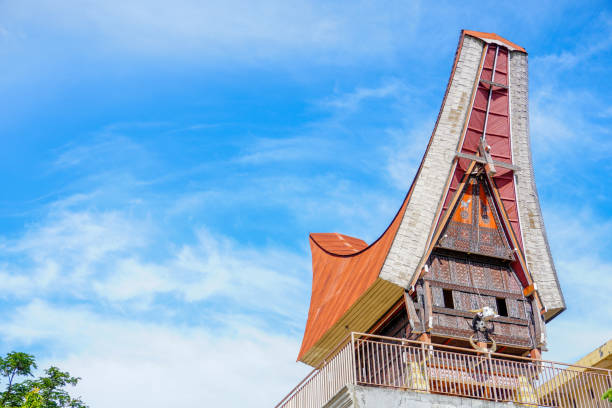 Tongkonan house replica with picturesque blue sky background. Tana toraja's cultural icon