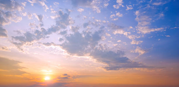 istock Sunset sky in the evening with yellow sunlight and clouds on blue majestic sky background in panoramic view 2153479042