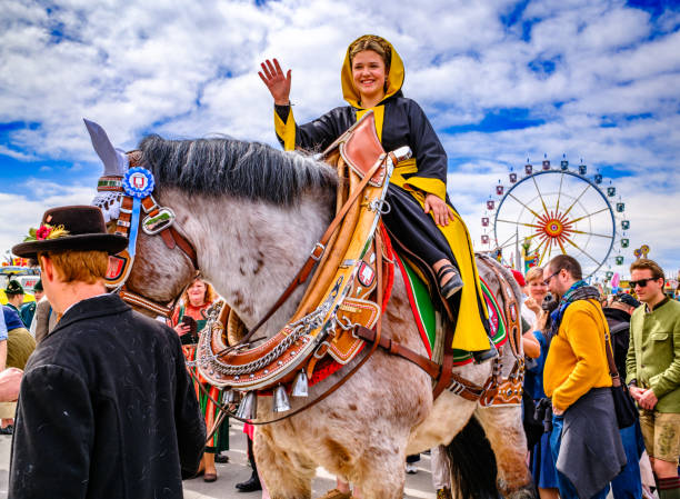 Munich, Germany - April 28:  participants with traditional clothes at a parade at the annual spring festival (frühlingsfest) in munich on April 28, 2024