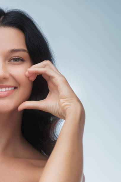 istock Smiling Woman Highlighting Oral Care 2153484941
