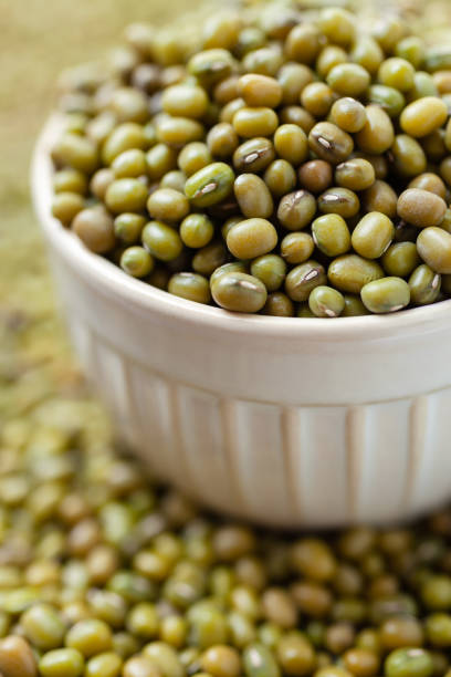 istock Uncooked, green mung beans in bowl 2153486482