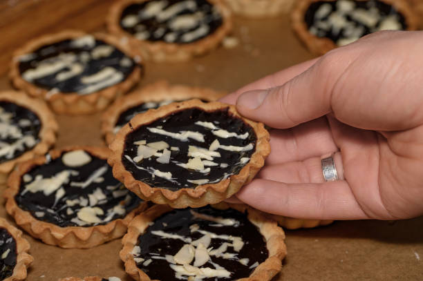 istock Homemade shortbread muffins, mini tarts, filled with chocolate and nuts 2153489252