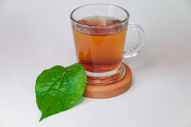 istock Glass filled with betel leaf herbal tea isolated on a white background 2153493875