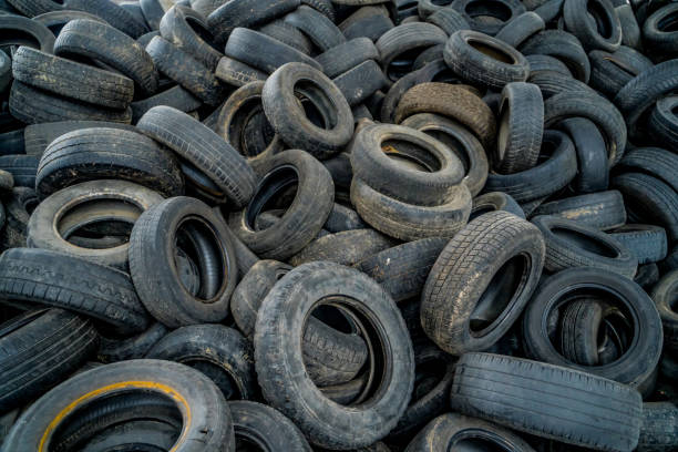 istock Used tires at recycling garbage field. Old tires trash storage. 2153494263