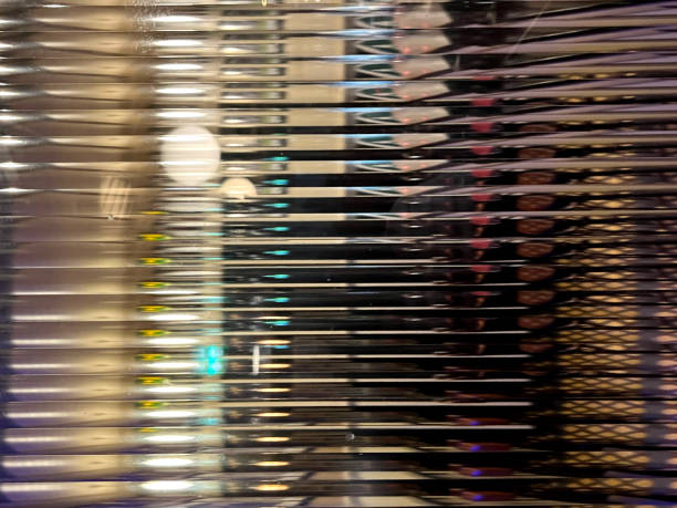 Shiny window glass with lines reflecting an interior