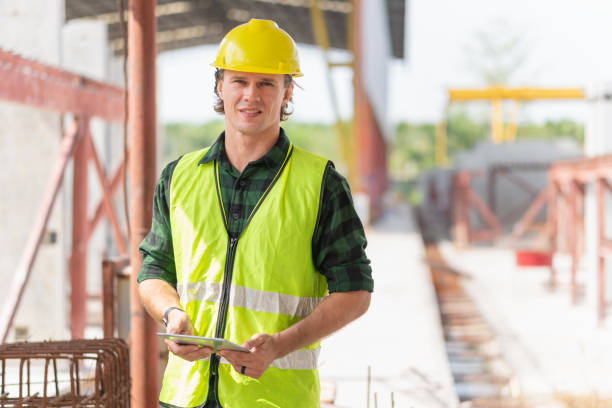 istock Engineer man with digital tablet checking project in the precast concrete factory site, Foreman worker at construction site 2153503978