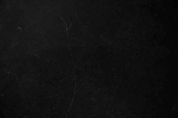 istock The black surface of the damaged wall as a background coating for your design with a grunge texture with scratches and gaps to copy 2153509607