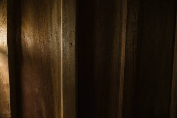 Wooden dark background. Wooden texture with warm light.