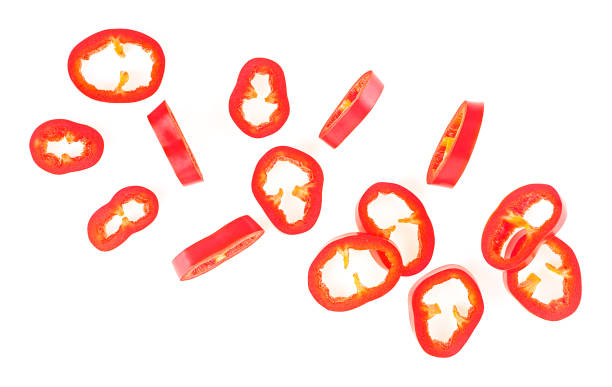 istock Red sliced chili pepper isolated on a white background, view from above. Fresh mexico hot cayenne spicy. 2153514664