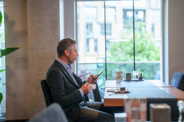 istock Businessman is using mobile phone at the hotel. 2153518214