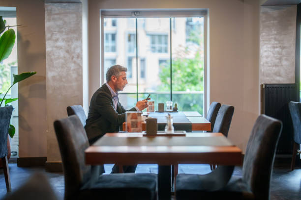istock Businessman is using mobile phone at the hotel. 2153518674