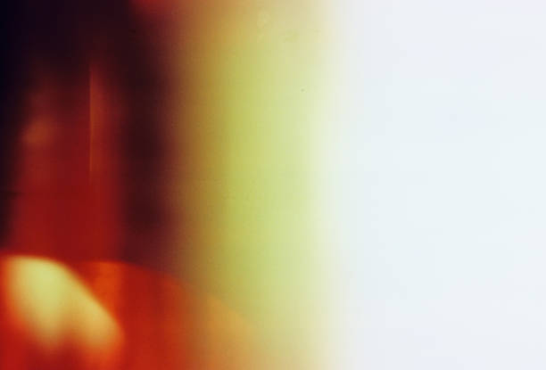Real analog film scan with a distinctive burned and grainy texture, showcasing vibrant orange and yellow hues