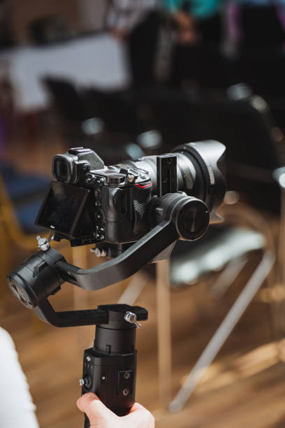 istock Person using camera accessory on gimbal for stable video shots 2153531876