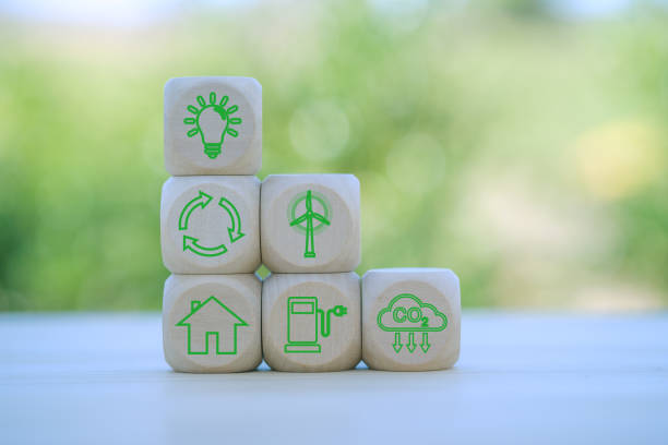 istock environment Earth concept. Net zero greenhouse gas emissions target. Climate neutral long term strategy. wooden cubes with decarbonization icon and green icon. Green banner. 2153533584