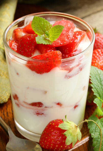 istock dessert yogurt with fresh strawberries in a glass 2153535036