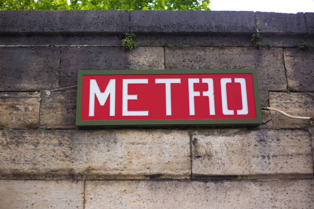 Paris, France: Vintage Red METRO Sign on Stone Wall