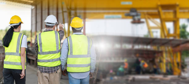 istock Group of Engineer and foreman worker team inspect the construction site, Site manager worker and builder on construction site 2153541911