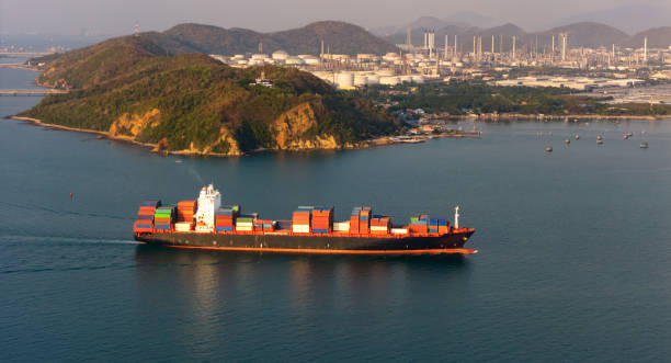 istock Top view Logistics and transportation of Container Cargo ship and Cargo plane with working crane bridge in shipyard at sunrise, logistic import export and transport industry background 2153542861