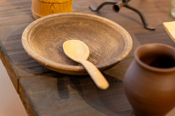 a rustic wooden cutlery with plates in a restaurant