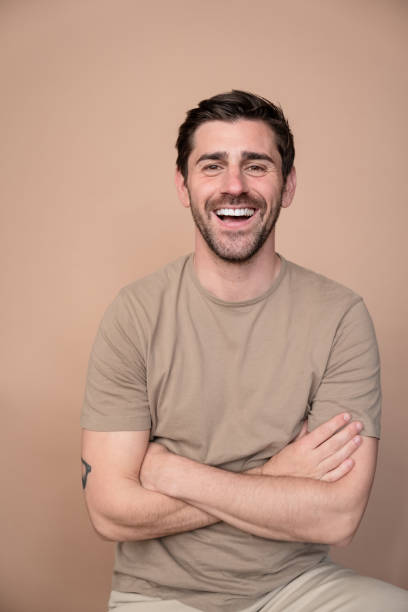istock Cheerful man with arms crossed 2153545036