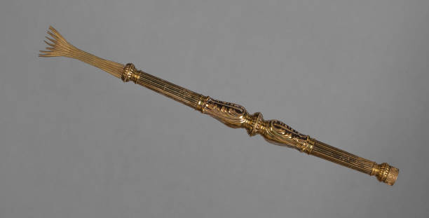 istock ancient golden staff isolated on black background 2153556628
