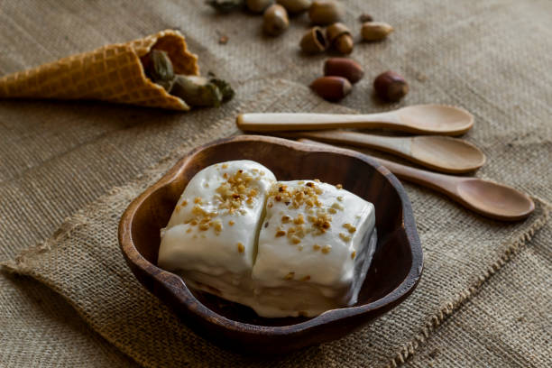Close-up taken of Vanilla vegan ice cream made from hazelnut milk, in a bamboo bowl