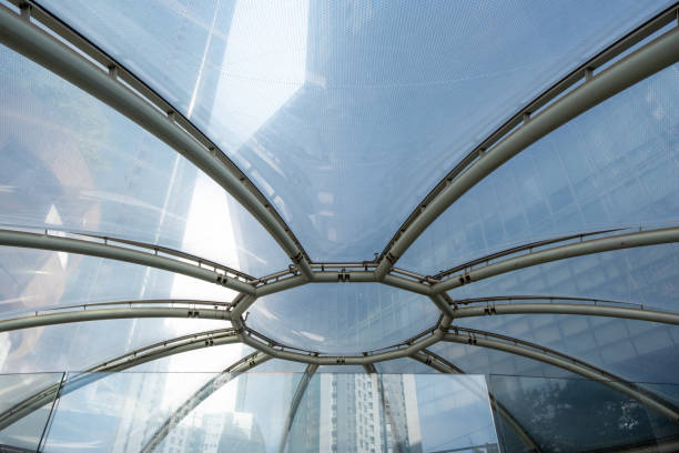 Amsterdam, The Netherlands - 23 April 2023: Interior view of the National Maritime Museum (Het Scheepvaartmuseum) Glass roof tiel ceiling see-through blue sky and white clouds on firmament, Holland.