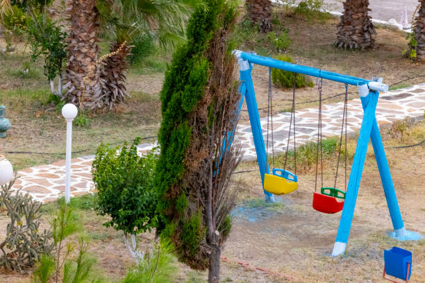 Empty colorful swings at the park.