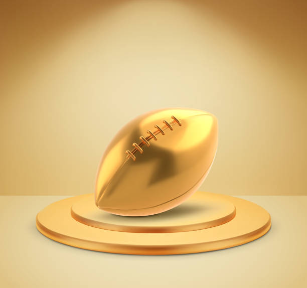istock Gold american football ball on a podium 2153564551