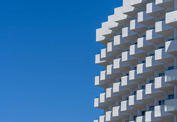 Spain, Palma Majorca, April 24, 2024 -Modern apartment building with balconies against clear sky