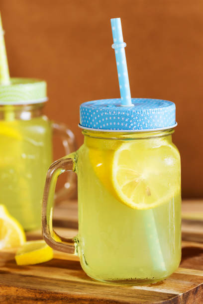 istock Ice cold home made lemonade jar on the table with some lemon in it. 2153570448