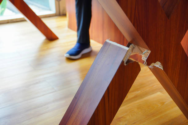 istock a broken wooden table leg, with a blurred background of someone sitting, creating an intriguing visual contrast 2153570662
