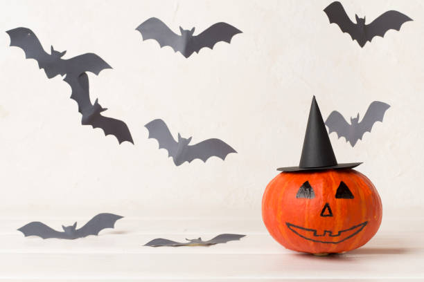 istock Halloween composition with jack o lanter decor on wooden table 2153571166