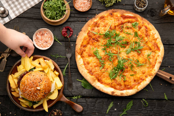istock Hand taking food top view 2153576114