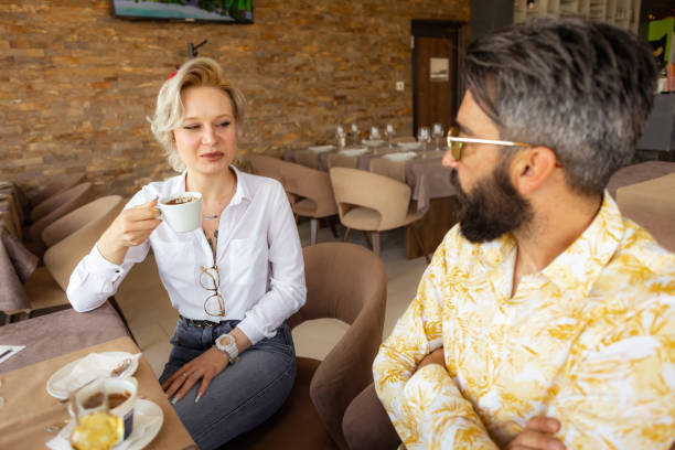 istock Colleagues Discussing Business Over Coffee and Brandy 2153578416