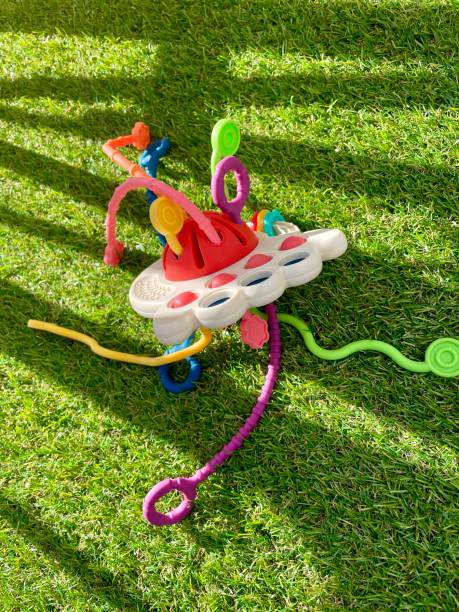 istock A bright children's toy lies on artificial grass 2153580927