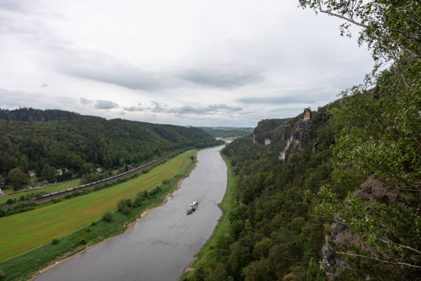 istock A river with a boat on it and a cloudy sky in the background 2153582377