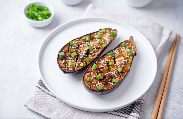 istock Teriyaki sesame seed baked eggplant in a plate 2153584503
