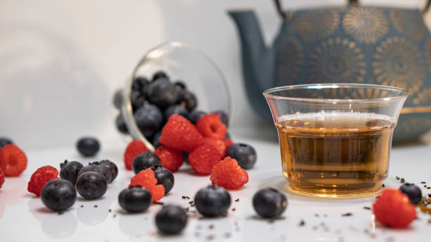 istock blueberries and raspberries and tea 2153584543