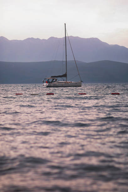 Sailing boat in sea at sunset. Summer vacation concept