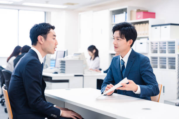 istock Young businessman working the counter 2153589690