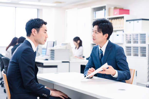 istock Young businessman working the counter 2153589693