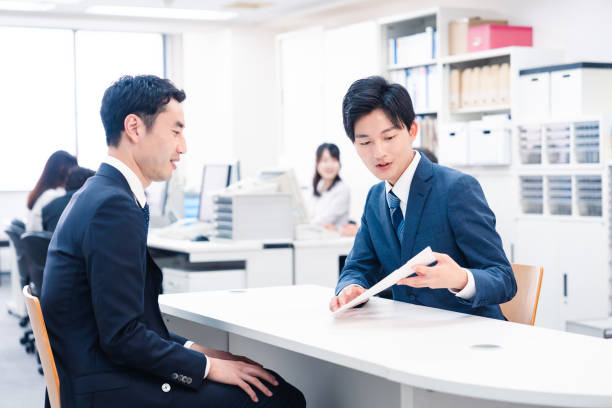 istock Young businessman working the counter 2153589709