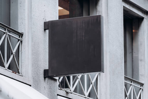istock blank black sign on building exterior 2153590759