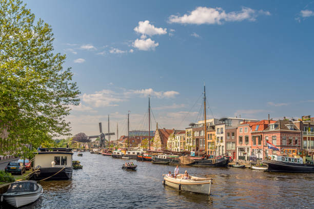 May 18, 2024 - Leiden, Netherlands: boats sail across the Galgewater in Leiden on a sunny day