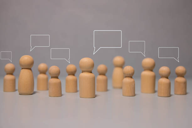 istock Group of young people standing behind white placeholder. 2153593152